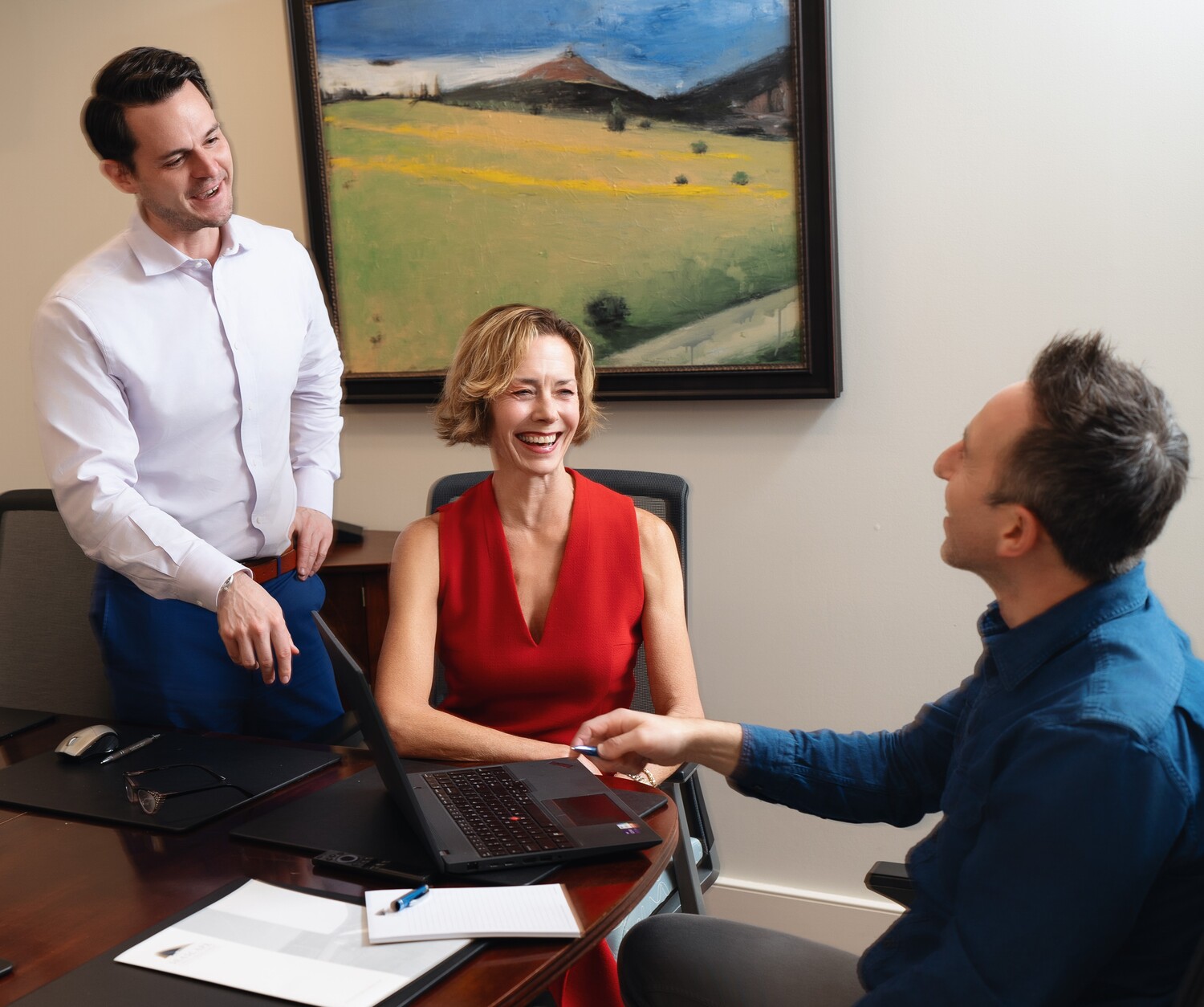 Monica McCarthy and Andrew Litzerman in a meeting with a client